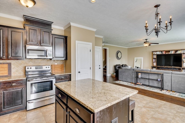 5558 Connor Dr, Evans, GA 30809 - kitchen with stainless steel appliances, open floor plan, dark brown cabinets, ornamental molding, and a textured ceiling