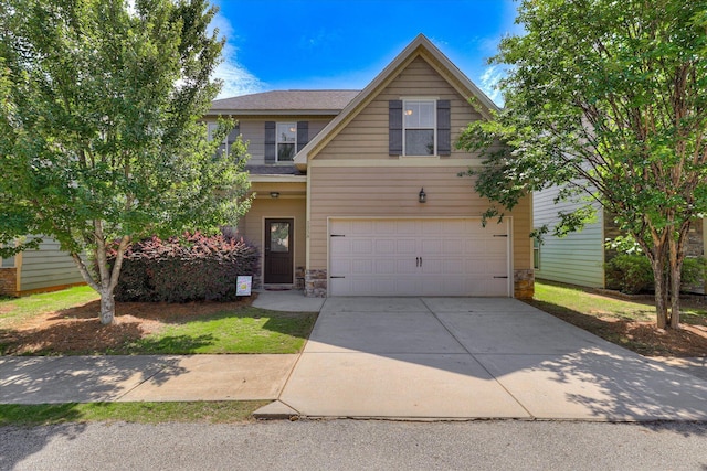 5558 Connor Dr, Evans, GA 30809 - view of front of house featuring an attached garage, driveway, and stone siding