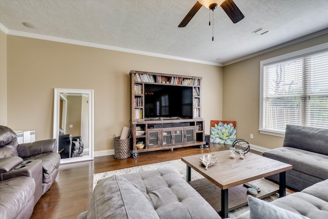 5558 Connor Dr, Evans, GA 30809 - living area featuring wood finished floors, a ceiling fan, a textured ceiling, ornamental molding, and radiator heating unit