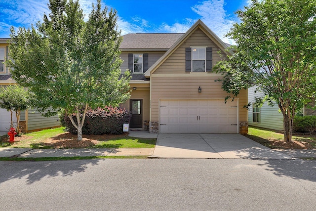 5558 Connor Dr, Evans, GA 30809 - view of front of property featuring concrete driveway, a garage, stone siding, and a shingled roof