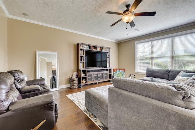 5558 Connor Dr, Evans, GA 30809 - living area featuring ceiling fan, wood finished floors, a textured ceiling, and crown molding