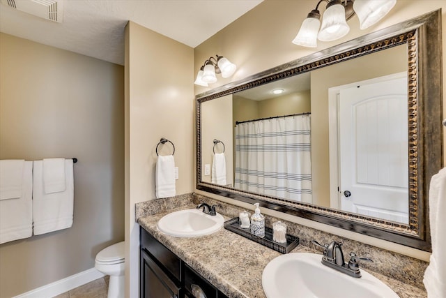 5558 Connor Dr, Evans, GA 30809 - bathroom with double vanity and tile patterned floors