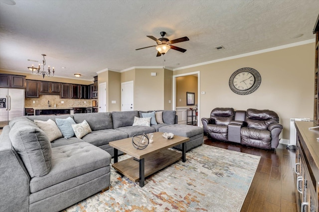 5558 Connor Dr, Evans, GA 30809 - living room featuring hardwood / wood-style flooring, a ceiling fan, a chandelier, and ornamental molding