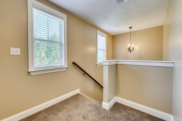 5558 Connor Dr, Evans, GA 30809 - stairway featuring a chandelier, carpet flooring, and healthy amount of natural light