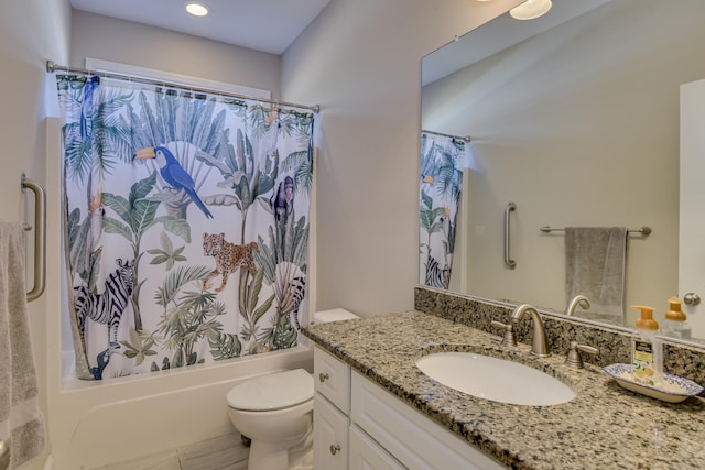 full bathroom featuring toilet, shower / bath combination with curtain, and vanity