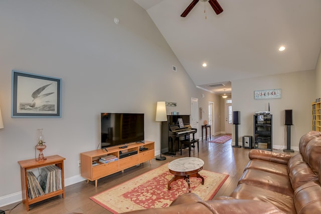 living room with high vaulted ceiling, wood finished floors, a ceiling fan, and baseboards