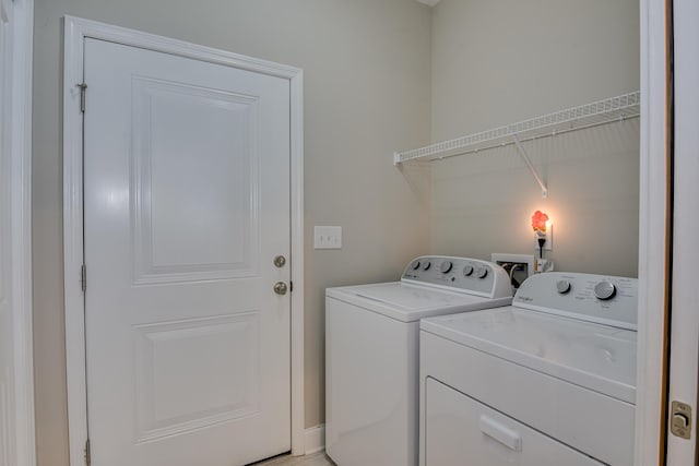 laundry room featuring washing machine and dryer and laundry area