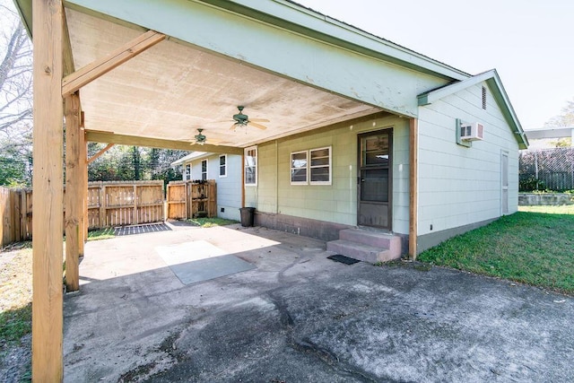 view of patio / terrace featuring entry steps, ceiling fan, and fence