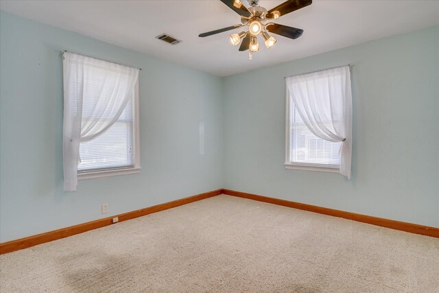 2125 Silverdale Rd, Augusta, GA 30906 - carpeted spare room featuring visible vents, baseboards, ceiling fan, and a wealth of natural light