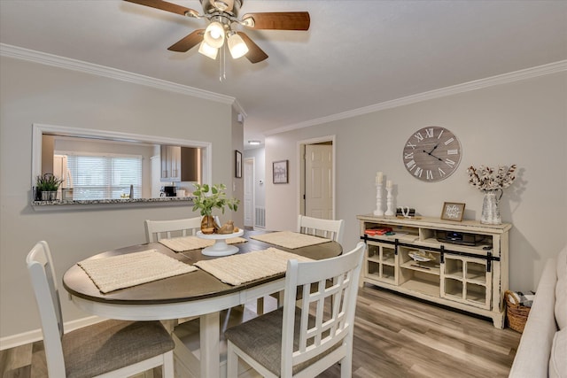 315 Coastal Cv, Mccormick, SC 29835 - dining area with crown molding, wood finished floors, and ceiling fan
