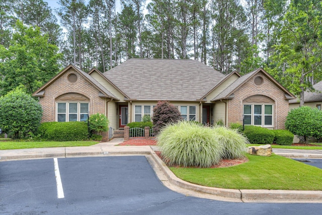 315 Coastal Cv, Mccormick, SC 29835 - ranch-style home featuring brick siding, a front yard, uncovered parking, and a shingled roof