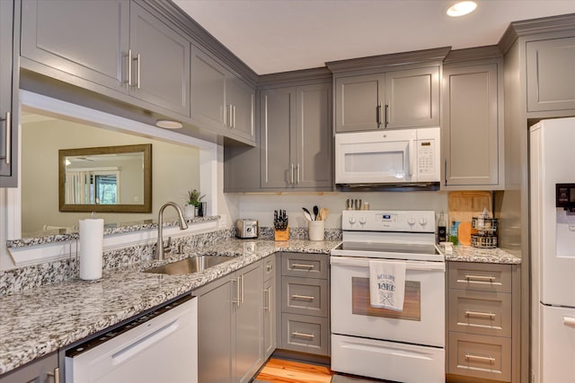 315 Coastal Cv, Mccormick, SC 29835 - kitchen featuring white appliances, a sink, gray cabinets, light stone counters, and recessed lighting