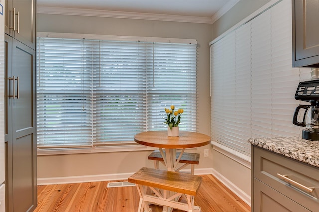 315 Coastal Cv, Mccormick, SC 29835 - dining space featuring light wood-style flooring, ornamental molding, and baseboards