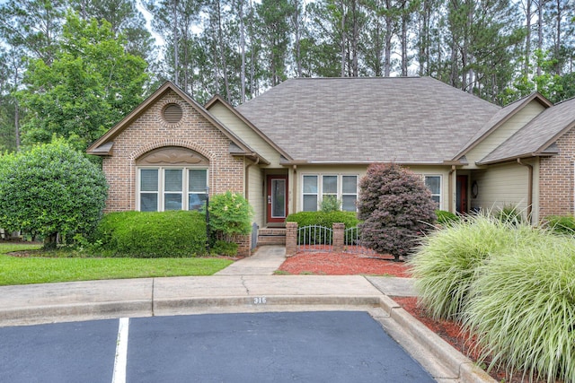 315 Coastal Cv, Mccormick, SC 29835 - view of front of home featuring brick siding, uncovered parking, and a shingled roof