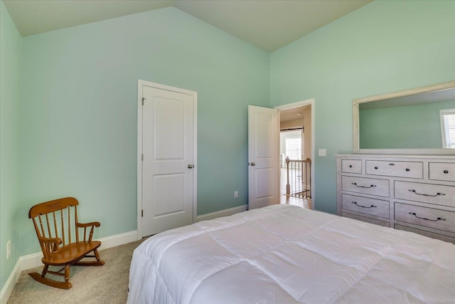 carpeted bedroom with vaulted ceiling