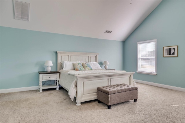 bedroom with vaulted ceiling and light carpet