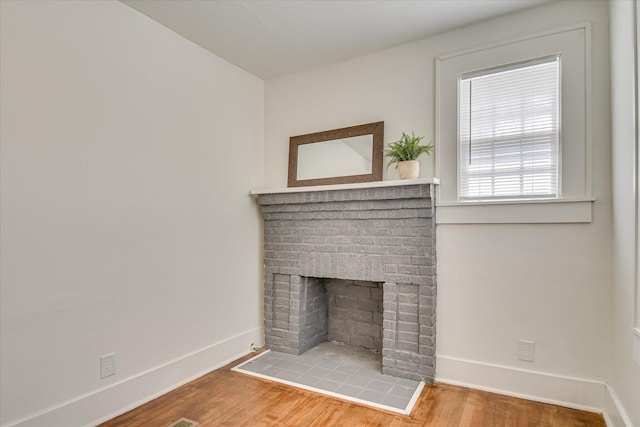 1847 Warren St, Augusta, GA 30904 - room details with a brick fireplace, baseboards, and wood finished floors