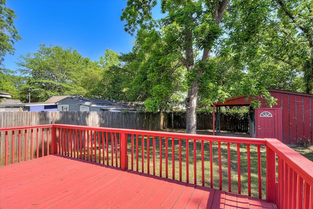 1847 Warren St, Augusta, GA 30904 - wooden terrace with a fenced backyard, an outdoor structure, a lawn, and a storage shed