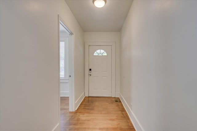 1847 Warren St, Augusta, GA 30904 - doorway with baseboards, visible vents, plenty of natural light, and light wood finished floors