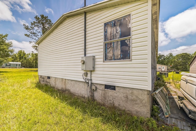 1167 Shawnee Ln, Stapleton, GA 30823 - view of side of home with crawl space and a lawn