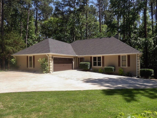 ranch-style house with a front yard and a garage