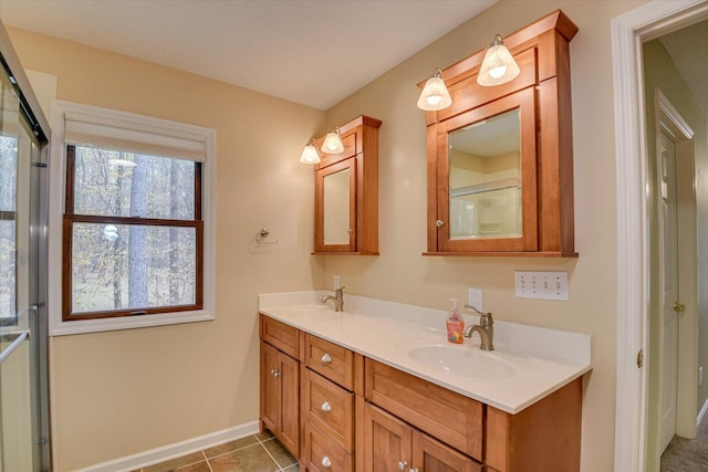 bathroom with vanity and tile patterned floors