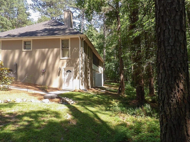 view of property exterior featuring a yard