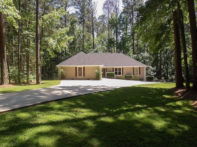 ranch-style home with a front lawn