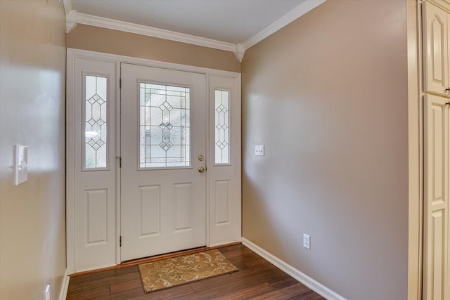 foyer entrance with ornamental molding and dark wood-type flooring