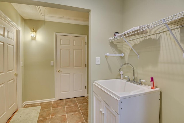 washroom featuring light tile patterned flooring and sink