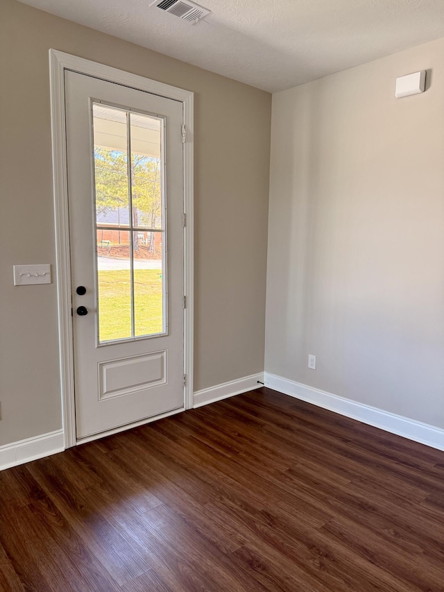 213 Whiskey Rd, Grovetown, GA 30813 - doorway to outside featuring dark wood finished floors, baseboards, and visible vents