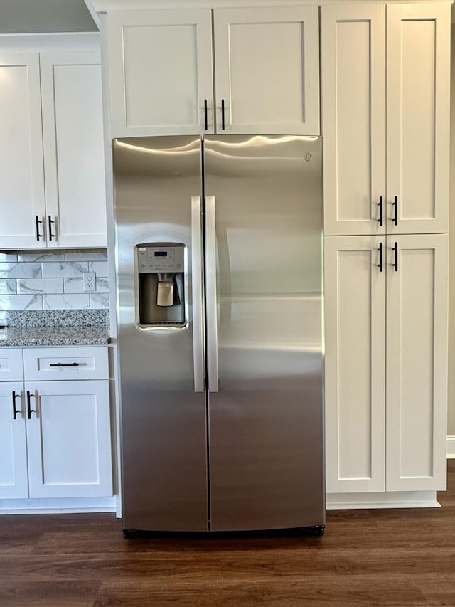 213 Whiskey Rd, Grovetown, GA 30813 - interior space featuring white cabinets, light stone countertops, stainless steel fridge with ice dispenser, and dark wood-style floors