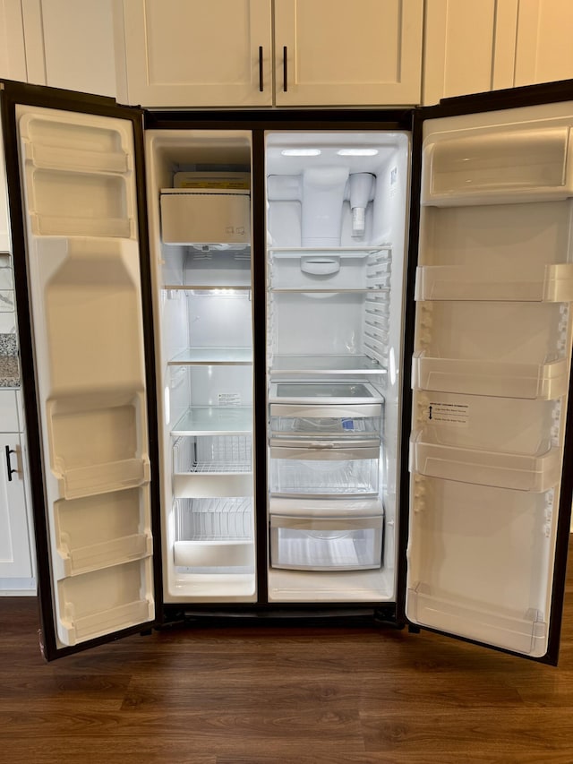 213 Whiskey Rd, Grovetown, GA 30813 - interior details featuring refrigerator with glass door and dark wood-type flooring