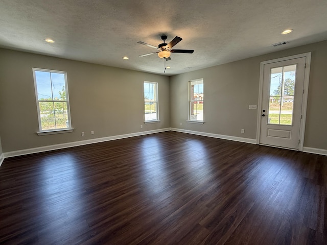 213 Whiskey Rd, Grovetown, GA 30813 - unfurnished room featuring a textured ceiling, dark wood-style floors, baseboards, visible vents, and ceiling fan
