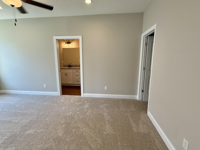 213 Whiskey Rd, Grovetown, GA 30813 - unfurnished bedroom with connected bathroom, baseboards, dark colored carpet, and recessed lighting