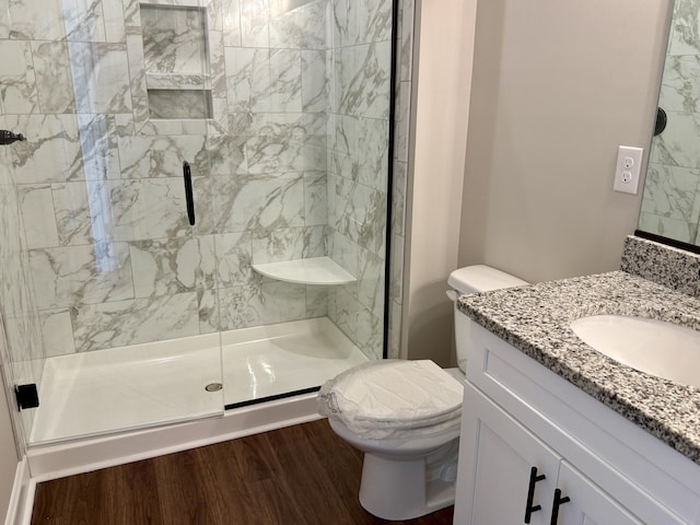 213 Whiskey Rd, Grovetown, GA 30813 - bathroom featuring a shower stall, toilet, wood finished floors, and vanity