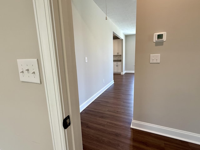 213 Whiskey Rd, Grovetown, GA 30813 - hall with baseboards, a textured ceiling, and dark wood-style floors