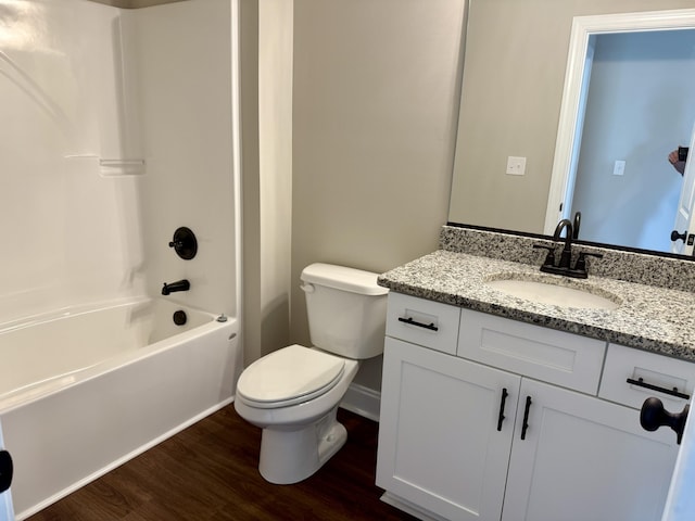 213 Whiskey Rd, Grovetown, GA 30813 - bathroom featuring vanity, toilet, baseboards, shower / bathtub combination, and wood finished floors