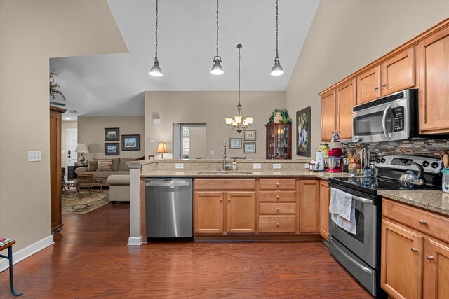 1223 Brookstone Way, Augusta, GA 30909 - kitchen featuring appliances with stainless steel finishes, a sink, a peninsula, a chandelier, and open floor plan