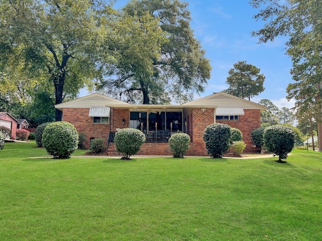 ranch-style house with a front yard