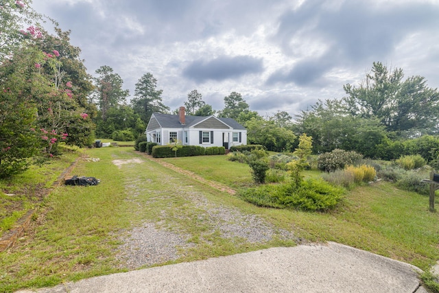 2217 Montclair St, Augusta, GA 30904 - view of front facade with a chimney, driveway, and a front yard