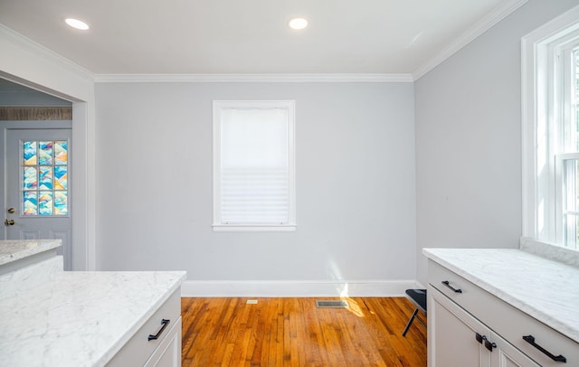 2217 Montclair St, Augusta, GA 30904 - unfurnished dining area with crown molding, light wood-type flooring, and recessed lighting