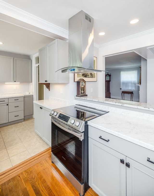 2217 Montclair St, Augusta, GA 30904 - kitchen with electric stove, exhaust hood, gray cabinets, crown molding, and light stone counters