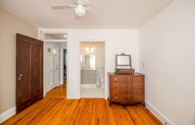 2217 Montclair St, Augusta, GA 30904 - bedroom with wood finished floors, ensuite bath, and a ceiling fan