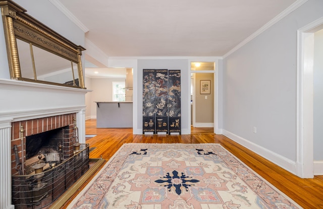2217 Montclair St, Augusta, GA 30904 - living room with wood finished floors, ornamental molding, and a brick fireplace
