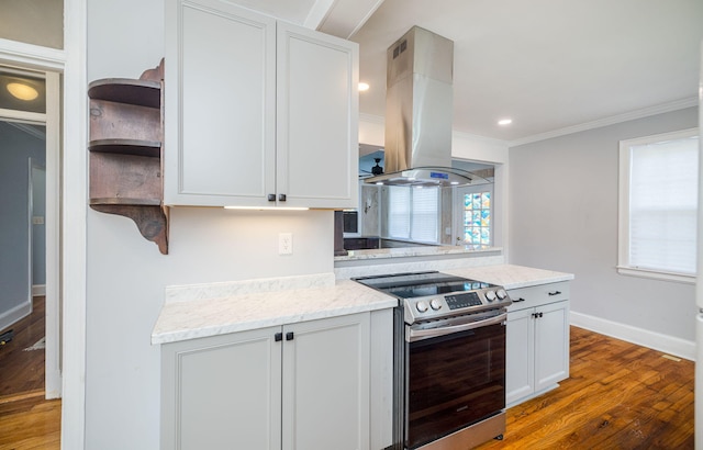2217 Montclair St, Augusta, GA 30904 - kitchen with stainless steel electric range oven, island exhaust hood, open shelves, wood finished floors, and light stone counters