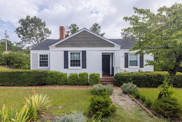 2217 Montclair St, Augusta, GA 30904 - view of front of house with a chimney, brick siding, and a front lawn