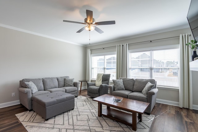 living area featuring ornamental molding, ceiling fan, baseboards, and wood finished floors