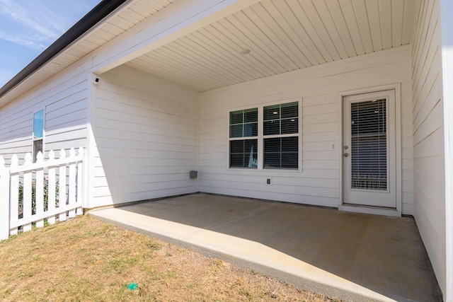 doorway to property with a patio area