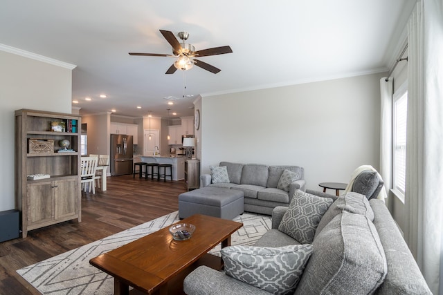 living area featuring crown molding, ceiling fan, dark wood-style flooring, and recessed lighting